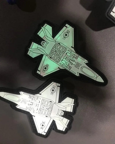  Two F-35 Lockheed-Martin Lightning II Glow-in-Dark PVC Morale Patches, one glowing and one regular