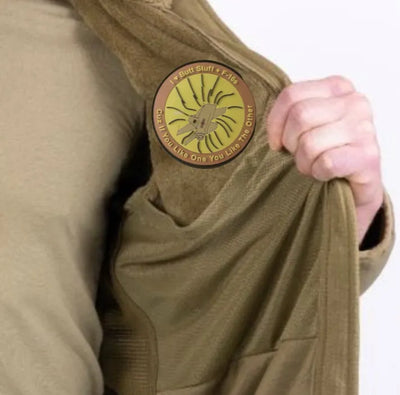 F-16 patch on inside of military fleece jacket
