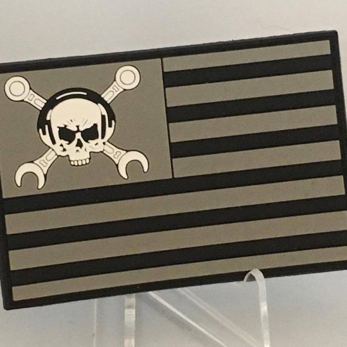  Maintainer Nation Flag PVC Morale Patch with skull and “cross-wrench” logo from Challenge Coin Nation on clear display stand