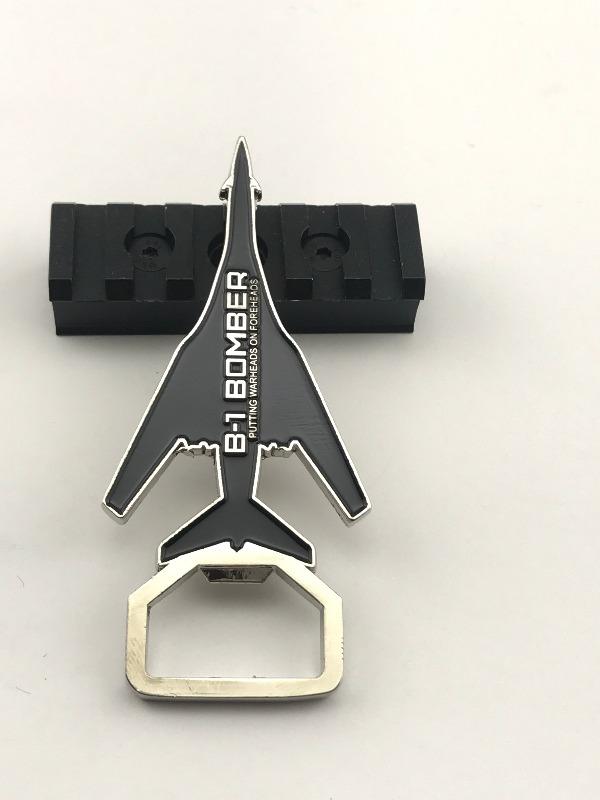  Underside of the B-1 Bomber Challenge Coin Bottle Opener, featuring the phrase “B-1 Bomber Putting Warheads On Foreheads”